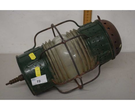 A vintage green painted metal lamp 