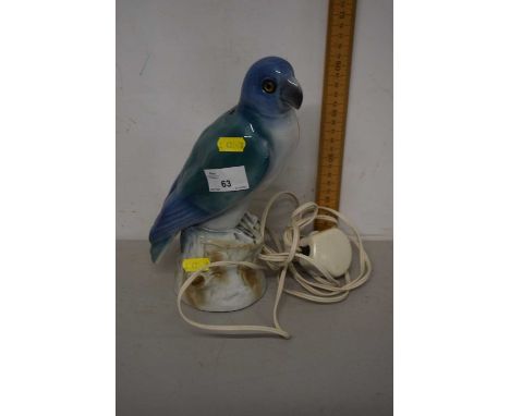 A capodimonte model of a parrot, modelled as a lamp