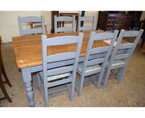 A painted pine kitchen table together with a set of six ladder back chairs
