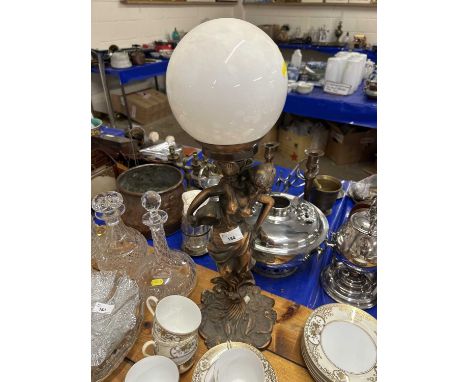 A lamp modelled as a lady with white lampshade
