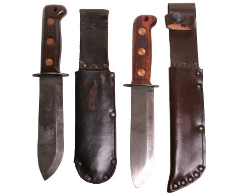 Pair of British Army Jungle Survival Knifes, both having single edged blades that measure 18cm and 17 ½ cm. Wooden handles wi