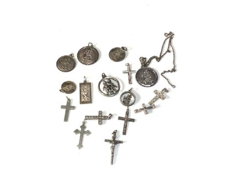 Selection of vintage silver crosses and st christopher pendants etc weight 49g 