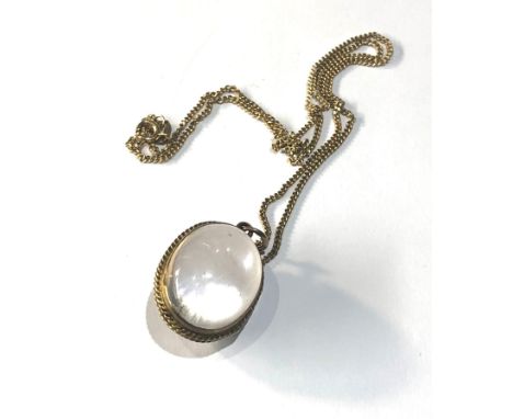 Antique 9ct Rock Crystal Pools of Light  Locket Pendant  on 9ct gold chain locket measures approx 2.5cm by 1.7cm 