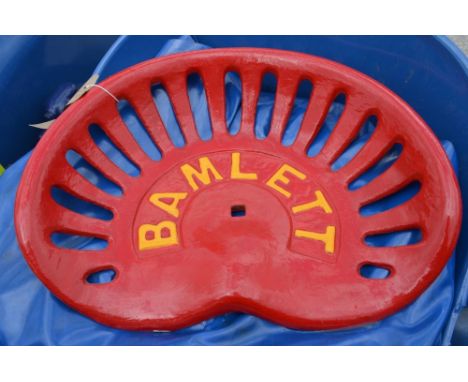 Painted cast metal Bamlett tractor seat. 