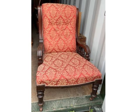 Victorian upholstered armchair, with button back and galleried turned open arms, on turned supports 