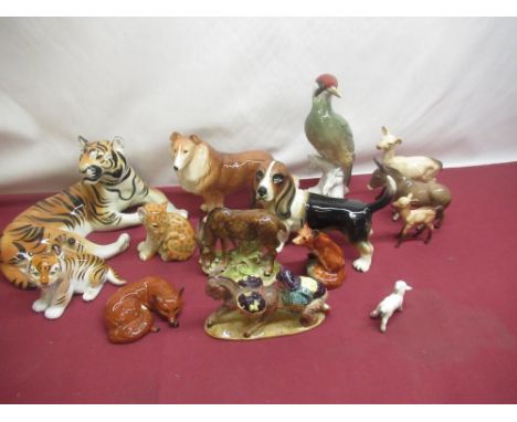 Beswick deer and fowl, fox, donkeys, and a collection of other ceramic animals including large Woodpecker, tiger, etc 