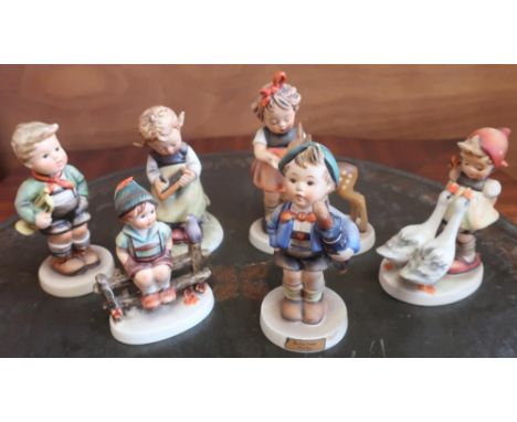 Collection of Hummel and Goebel figures including: Busy Student, Home from Market, Friends, and three others (6) 