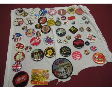 Collection of various button badges including Elvis , Buddy Holly. Elton John, ELO, Queen, Rolling Stones, two sew on patches