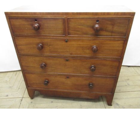 19th century mahogany chest two short and three long graduated cockbeaded drawers with turned wooden handles on shaped apron 