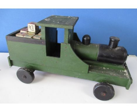 Vintage green and black painted push along model of a steam engine, L52cm H27cm, and a collection of alphabet bricks 
