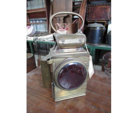 J &amp; R Oldfield "Dependence" brass lamp with red front lens, patent Rd. No. 42?005, H26cm and a Duntafil patent candle lam