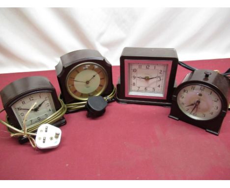 Two 1930s Smiths Sectric, Bakelite cased electric mantle clocks, similar 1930s Temco Bakelite cased alarm clock and a St.Mich