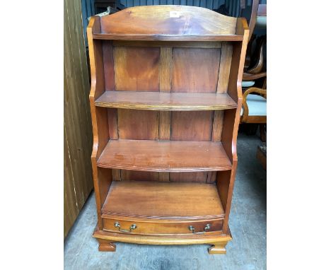 Small modern waterfall type bookcase with base drawer on bracket feet 