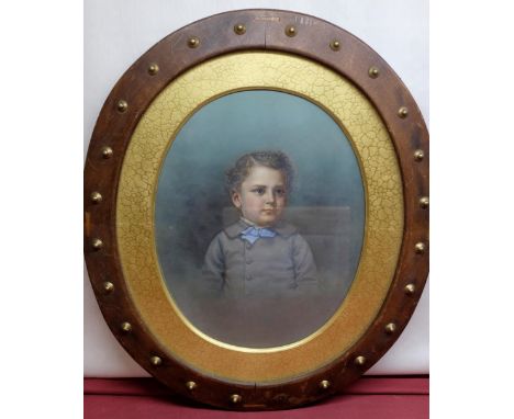 English School (C20th): Portrait of a young boy, half length in grey frock coat, over painted photograph, indistinctly signed