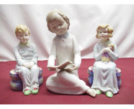 Nao figure of young girl seated reading a book, stencil mark to base and impressed numbers, H16cm, pair of Paragon figures of