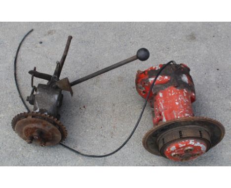 Two vintage manual gearboxes (possibly motorbike gearboxes), orange one with no makers marks, the other an Albion 3 speed 