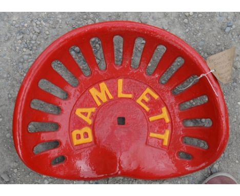 Painted Bamlett cast metal tractor seat. 