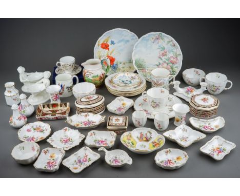 A pair of Royal Worcester Blanc de Chine salts in the form of Merboys holding a shell, pattern no 349, green factory marks to