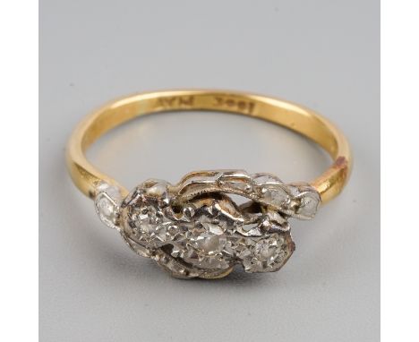 An Edwardian 18ct yellow gold and diamond three-stone ring, platinum settings, size K, gross weight approx 2.3g 