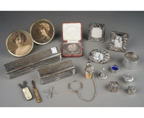 A group of silver to include: two various early 19th Century silver mounted travelling case glass boxes and cover, the covers
