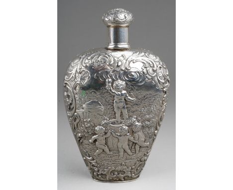 A Victorian silver heart shaped spirit flask, the body chased and engraved putti frolicking in Arcadian landscapes withing fo