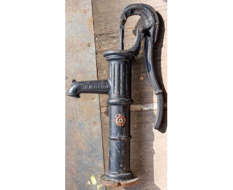 A vintage cast metal water pump 