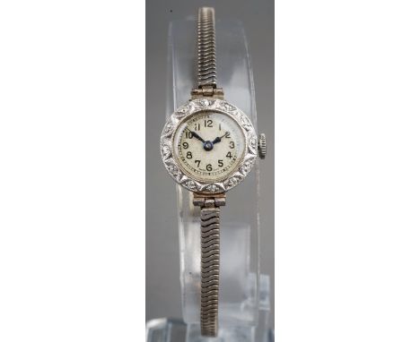 Vintage ladies platinum and diamond cocktail watch, fitted with a 9 ct white gold strap. Gross weight 15.9g 