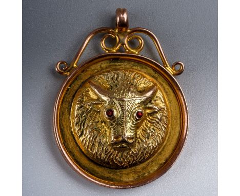 Order of The Buffalo Interest - a 9ct yellow gold circular medallion, cast with a buffalo head set with ruby eyes, inscribed 
