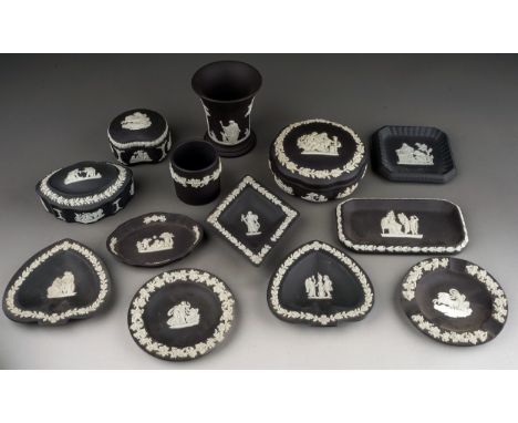 A collection of thirteen pieces of 20th century black basalt Wedgwood, including three trinket boxes and covers, a small coni