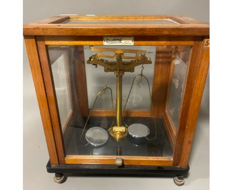 A cased L Oertling of London Model 48 scientific balance scales, in wooden and glazed case, the case approx 37.5cm wide x 27.