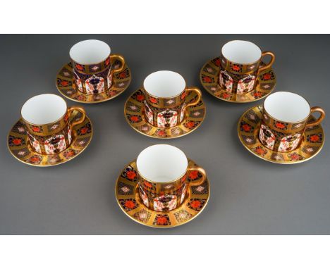A set of six Royal Crown Derby Imari 1128 solid gold band coffee cans and saucers, five bear date code 1987 and one bears dat