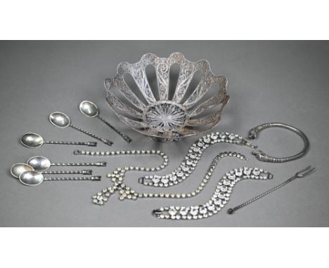 A continental white metal filigree bowl on raised foot, 16cm diameter, to/w a set of six unmarked coffee spoons, an .830 grad