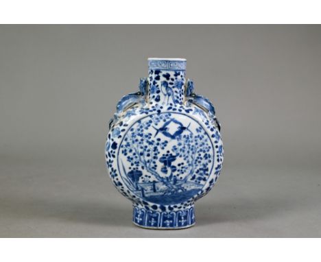 A 19th century Chinese blue and white moon flask vase with applied chilong dragon handles, painted in underglaze blue with bi