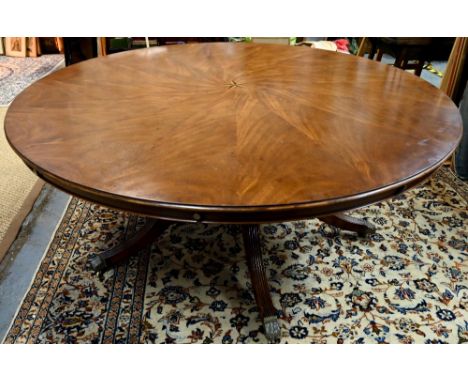 A large George IV style circular extending mahogany dining table by Arthur Brett, model 2239 'Mayfair', with centre star inla