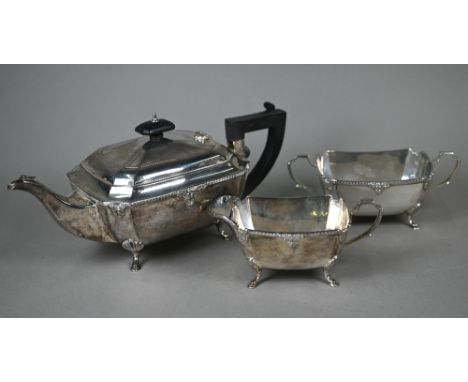 A heavy quality oblong silver three-piece tea service with moulded rims and hoof feet, ebonised finial and composite handle, 