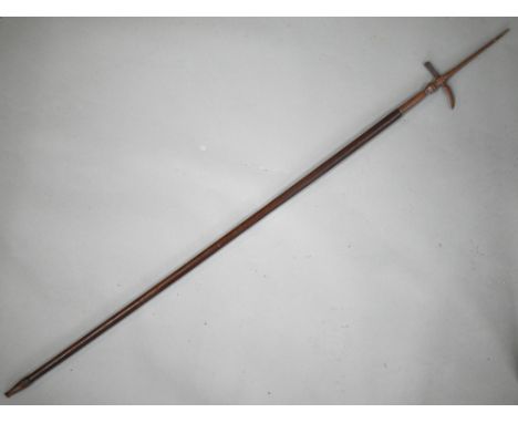 A vintage Indian Mahout's ankusha (elephant goad) with steel top and wooden shaft, 140 cm long 