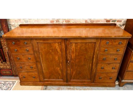 Holland &amp; Son, a late 19th century satinwood low compactum, centred by a pair of cabinet doors enclosing a shelf and line