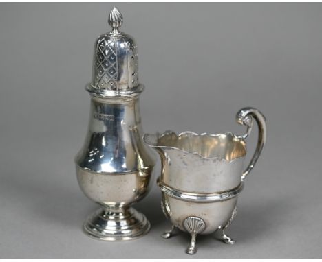 A late Victorian silver helmet-shaped cream jug in the Georgian manner, with scroll handle and hoof feet, Mappin &amp; Webb, 