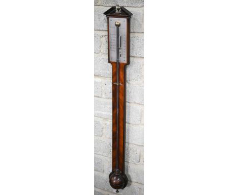 Dollond, London, a 19th century mahogany stick barometer, the broken arched pediment centred by a brass urn finial, over an e