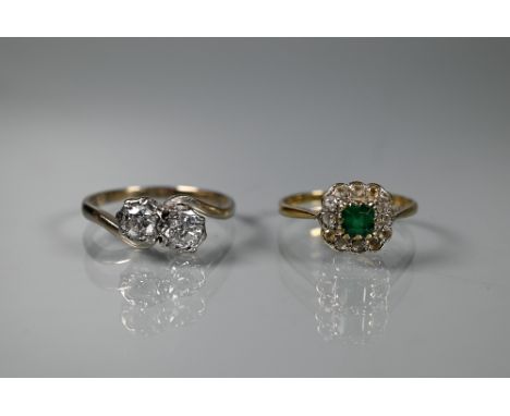 A two stone diamond crossover ring, claw set 18ct white gold, size R to/w a square emerald and diamond cluster ring, 9ct yell