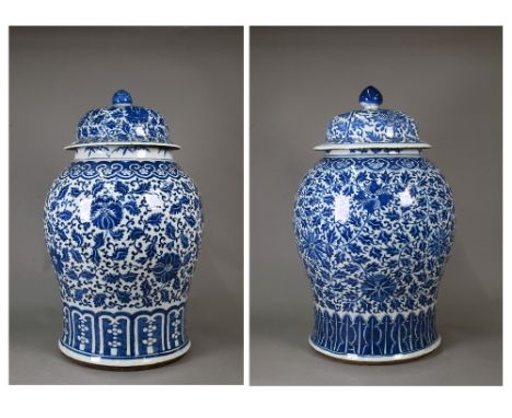 Two large 19th century Chinese blue and white temple jars and domed covers, painted in rich tones of underglaze blue with a s