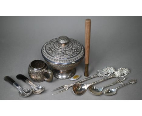 An Indian white metal stemmed bowl and cover, richly chased with floral and foliate decoration, on weighted foot, 12.5cm diam