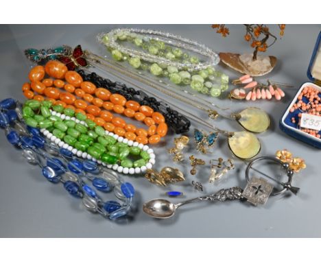 A collection of vintage and later jewellery including beads necklaces, loose beads, etc and an assortment of ladies and gent'