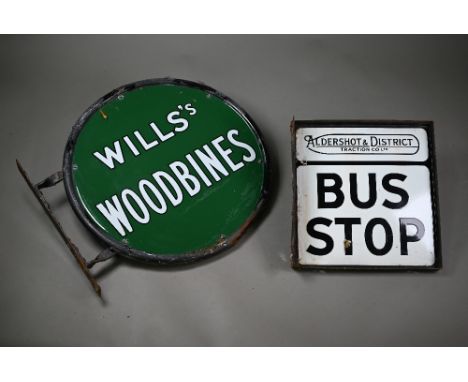 A vintage enamel two-sided shop advertising sign, 'Wills's Woodbines', 45 cm, to/w an Aldershot &amp; District Traction Co. L