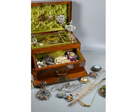 A Victorian hardwood jewel casket with green silk and velvet interior, containing a collection of vintage and later costume j