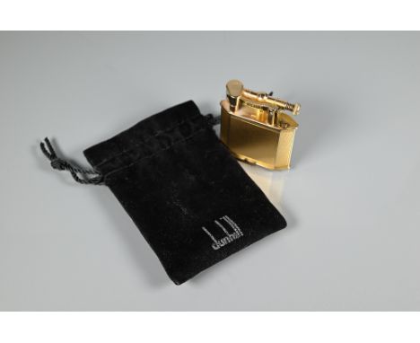 Dunhill - A 9ct yellow gold lighter with engine turned decoration, model no 390107, 4.2 x 3.8cm Prov: By repute formerly owne