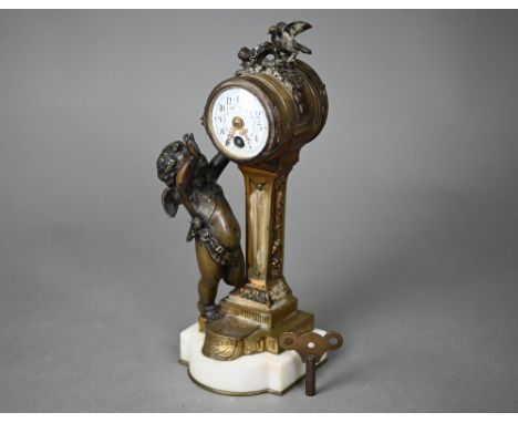 A small French gilt brass brass cherub and dove mounted 8-day mantel clock, the drum movement with garland enamelled dial rai