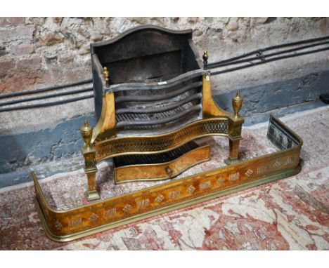 A large George III style brass and cast iron fire grate, of serpentine form, 77 cm w x 66 cm h o/all to/with an associated pi