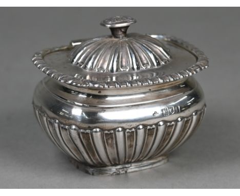 An Edwardian silver half-reeded and fluted sugar basin with hinged cover,&nbsp;Horace Woodward &amp; Co Ltd, London 1904, 7.2