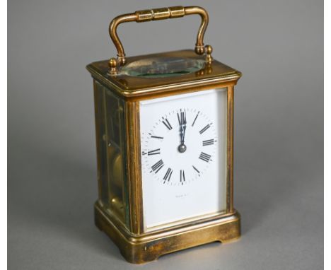 Maple &amp; Co, a lacquered brass French 8-day carriage clock, striking the hours on a coiled gong, with white enamelled Roma